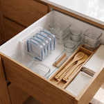 LidLoft 10-Slot organizer holding a full row of food-storage lids under a cabinet shelf