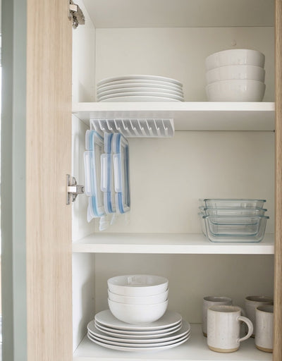 Customer photo — LidLoft 10-Slot organizer in a light wood cabinet with plates and mugs