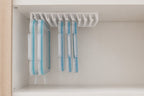 A hand slides one food-storage lid out of the LidLoft 10-Slot under-shelf organizer — grab and go